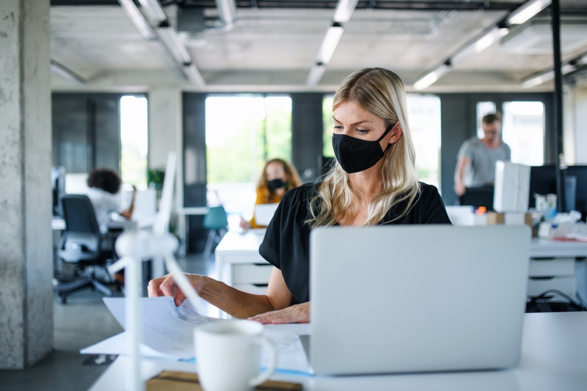 Woman at work with mask